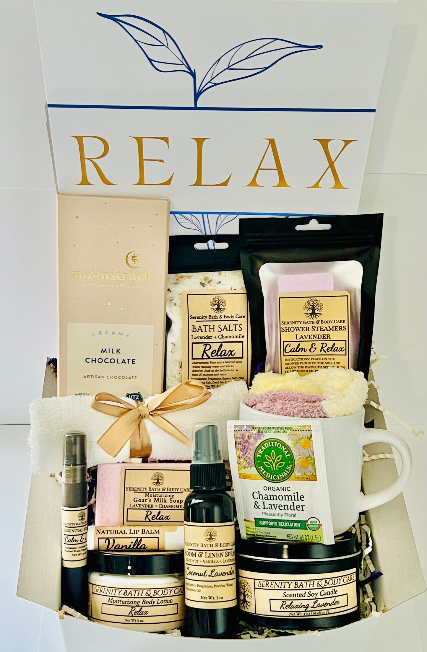 Luxury spa gift box for women with lavender and chamomile bath salts, soap, lotion, candle, tea, chocolate, cozy socks, and mug in a white βRelaxβ gift box. Perfect for birthdays, Christmas, or self-care gifting.