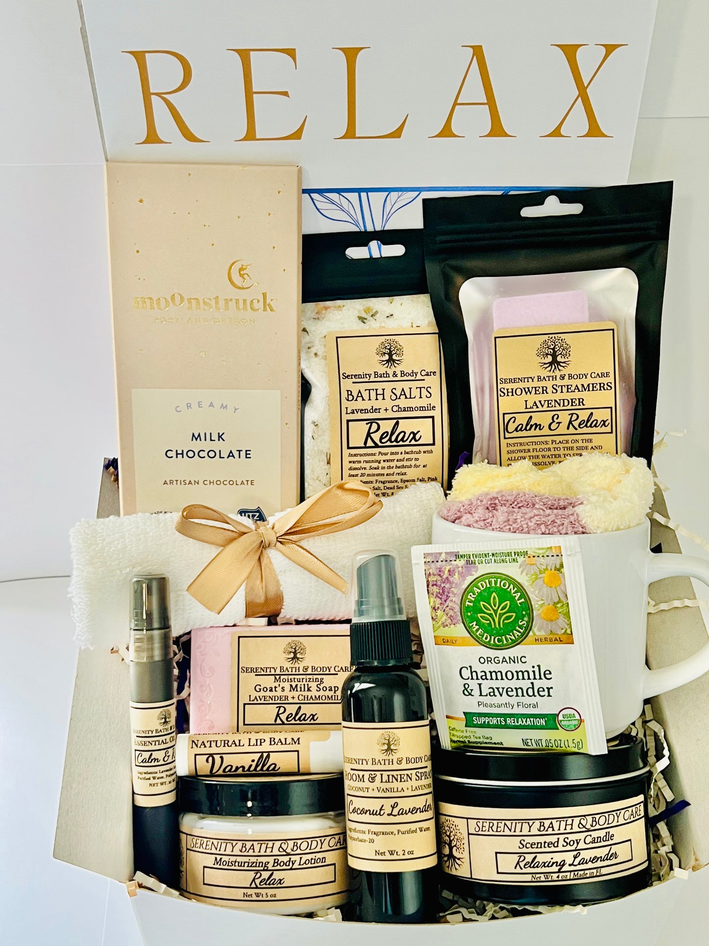 Luxury spa gift box for women with lavender and chamomile bath salts, soap, lotion, candle, tea, chocolate, cozy socks, and mug in a white βRelaxβ gift box. Perfect for birthdays, Christmas, or self-care gifting.