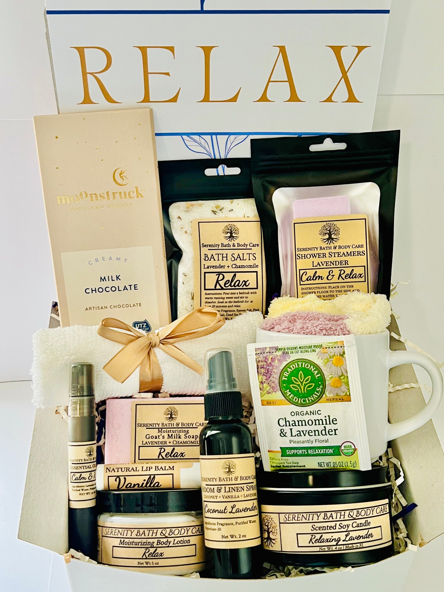 Luxury spa gift box for women with lavender and chamomile bath salts, soap, lotion, candle, tea, chocolate, cozy socks, and mug in a white βRelaxβ gift box. Perfect for birthdays, Christmas, or self-care gifting.