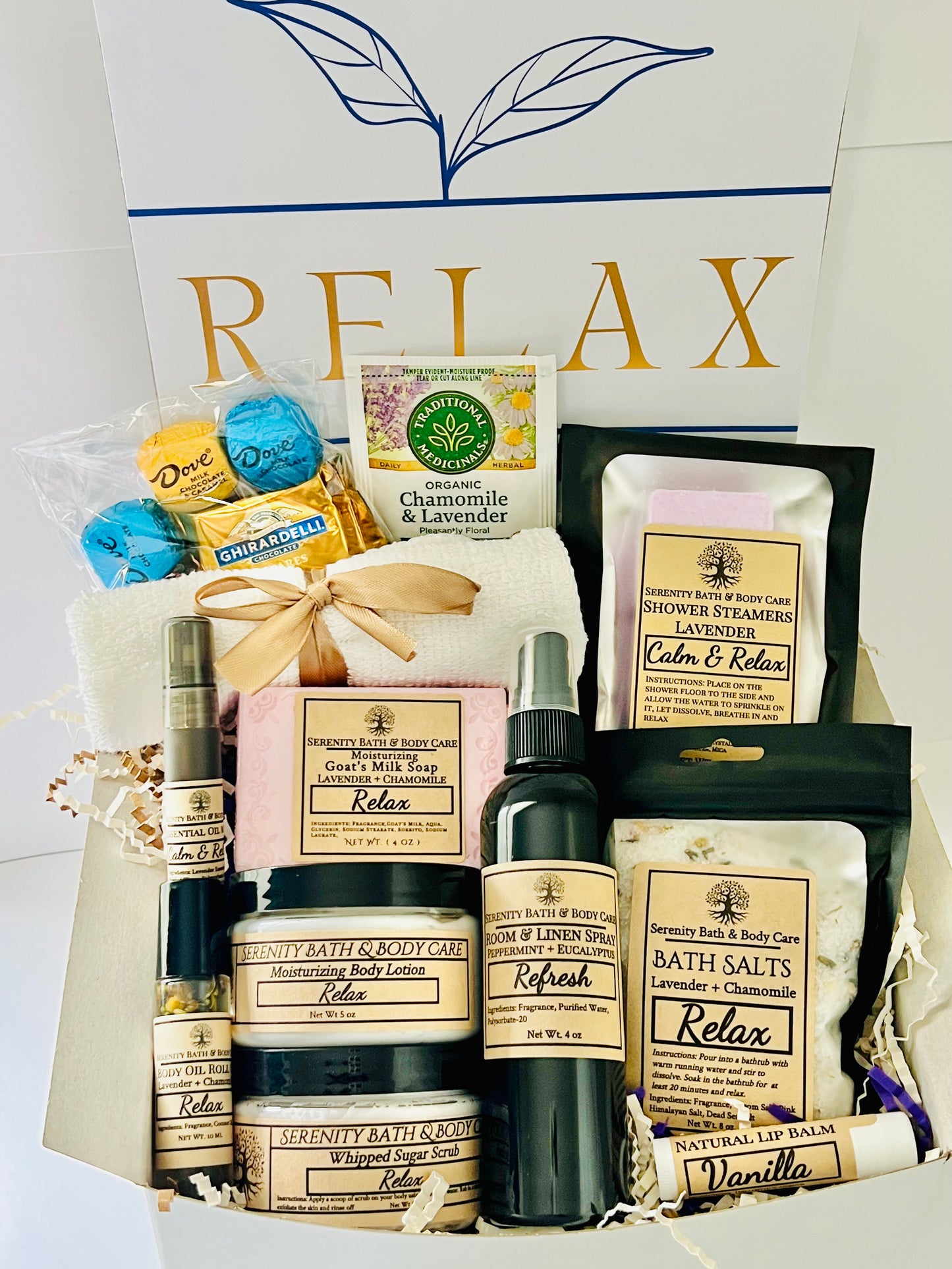 Luxury spa gift box for women with lavender and chamomile bath salts, soap, lotion, candle, chocolates, tea, and cozy socks in a white “Relax” box — perfect self-care, birthday, or holiday gift.