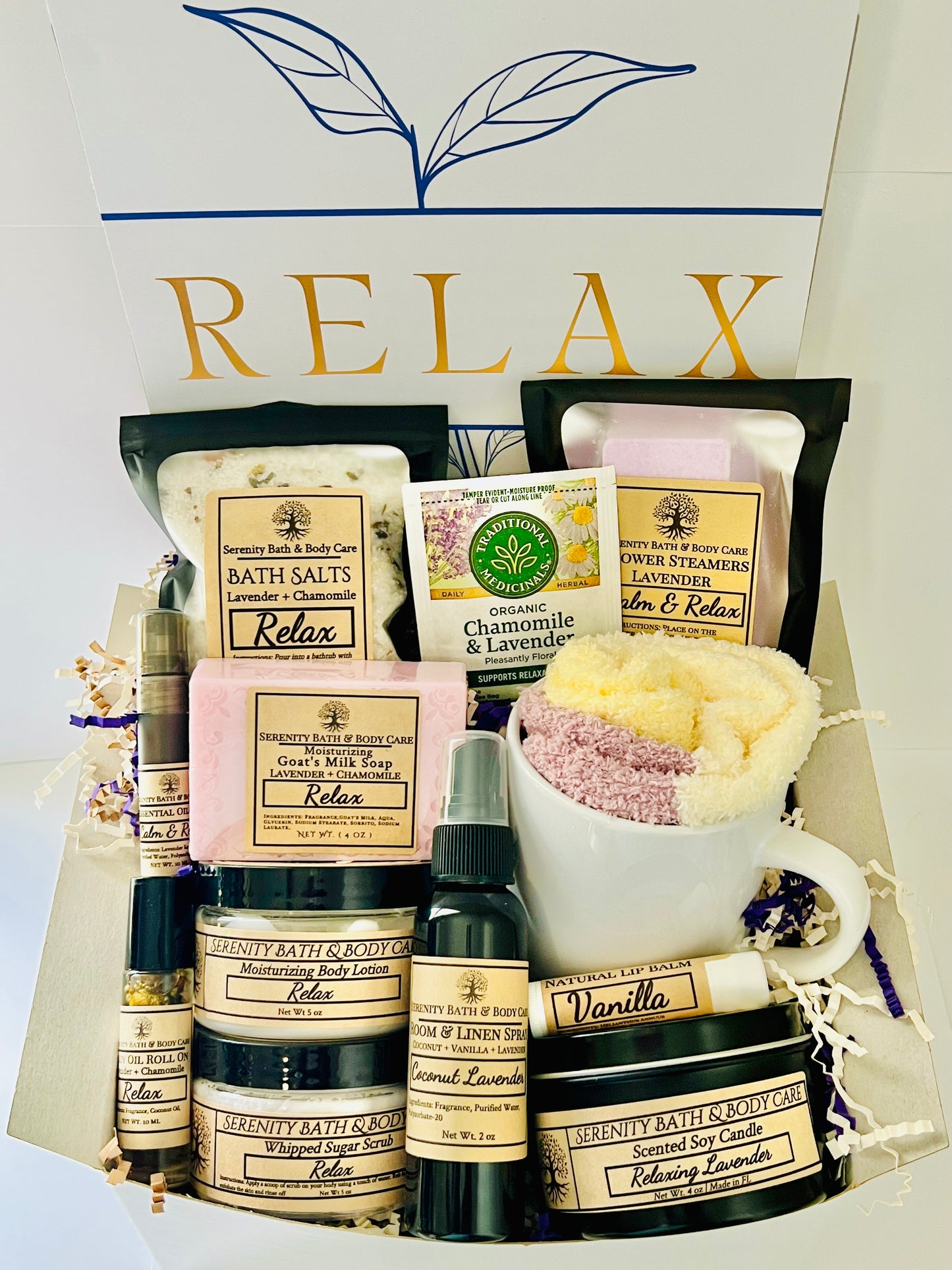 Luxury spa gift box for women with lavender and chamomile bath products, candle, lotion, tea, and cozy socks beautifully arranged in a “Relax” gift set. Perfect birthday, Christmas, or self-care gift.