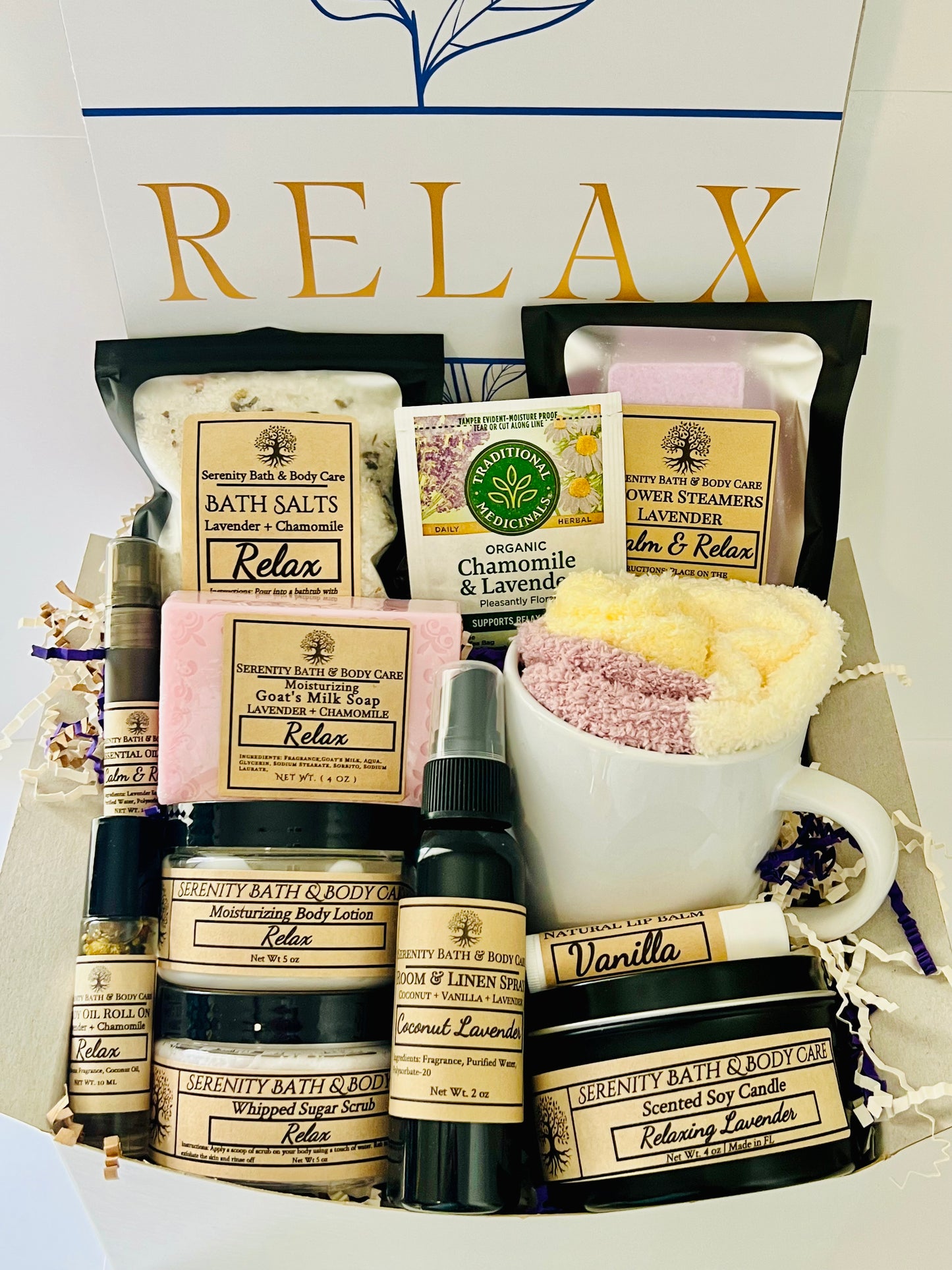 Luxury spa gift box for women with lavender and chamomile bath products, candle, lotion, tea, and cozy socks beautifully arranged in a “Relax” gift set. Perfect birthday, Christmas, or self-care gift.