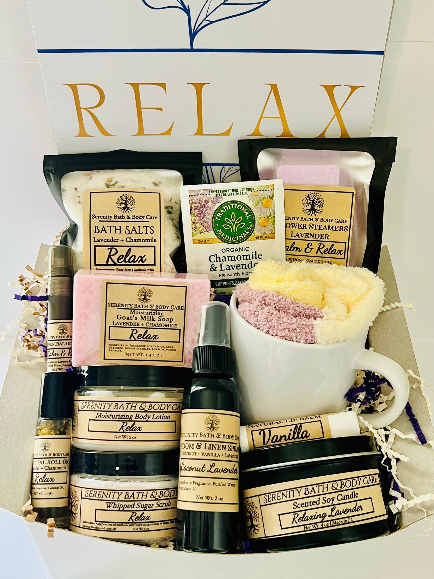 Luxury spa gift box for women with lavender and chamomile bath products, candle, lotion, tea, and cozy socks beautifully arranged in a “Relax” gift set. Perfect birthday, Christmas, or self-care gift.