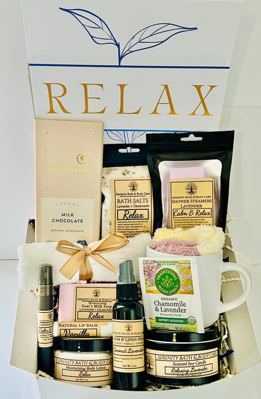 Luxury spa gift box for women with lavender and chamomile bath salts, soap, lotion, candle, tea, chocolate, cozy socks, and mug in a white “Relax” gift box. Perfect for birthdays, Christmas, or self-care gifting.