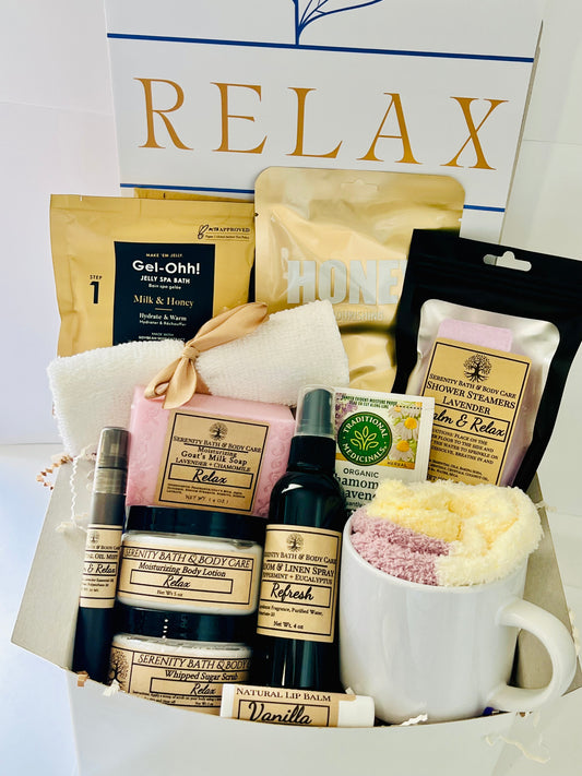 Luxury spa gift box for women with lavender, honey, and chamomile bath products, candle, lotion, tea, cozy socks, and mug in a white “Relax” box — perfect birthday, Christmas, or self-care gift.