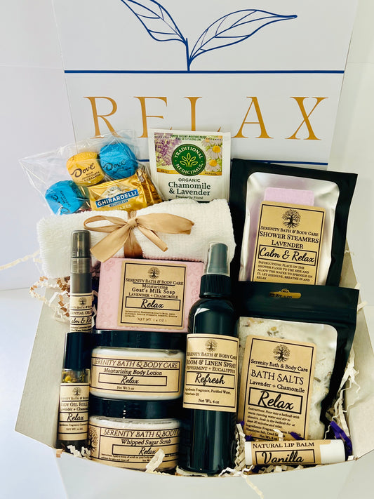 Luxury spa gift box for women with lavender and chamomile bath salts, soap, lotion, candle, chocolates, tea, and cozy socks in a white “Relax” box — perfect self-care, birthday, or holiday gift. 