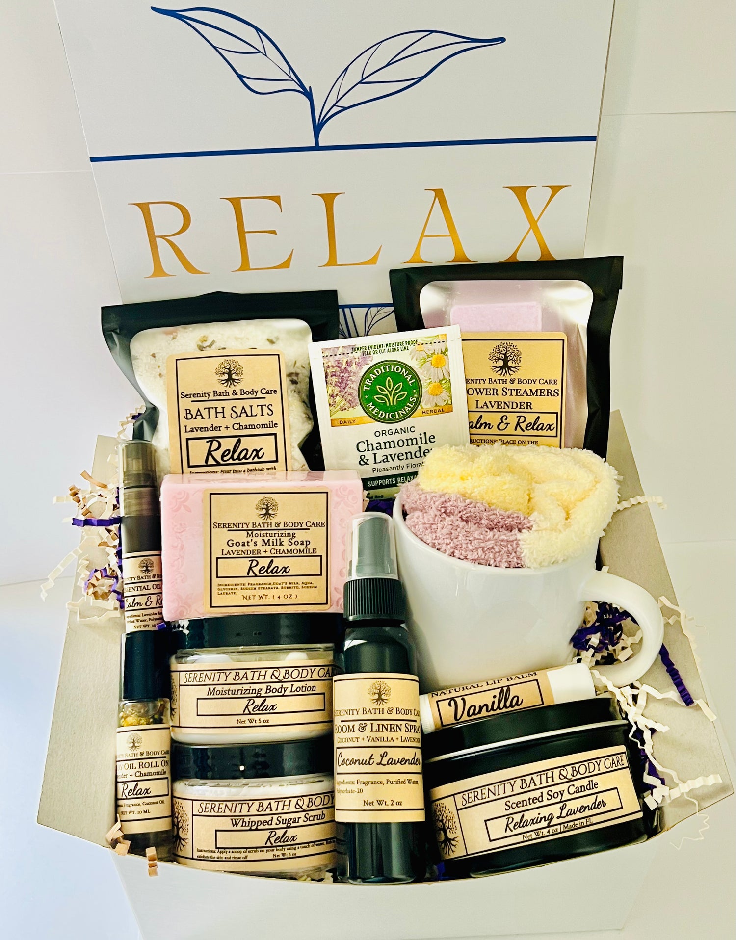 Luxury spa gift box for women with lavender and chamomile bath products, candle, lotion, tea, and cozy socks beautifully arranged in a “Relax” gift set. Perfect birthday, Christmas, or self-care gift.