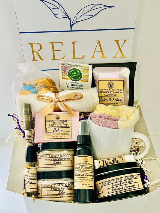 Luxury lavender spa gift box for women with bath salts, soap, lotion, candle, tea, cozy socks, and mug in a white “Relax” box — perfect self-care, birthday, or holiday gift.