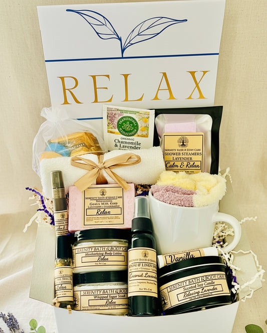 Luxury lavender spa gift box for women with bath salts, soap, lotion, candle, tea, cozy socks, and mug in a white “Relax” box — perfect self-care, birthday, or holiday gift.
